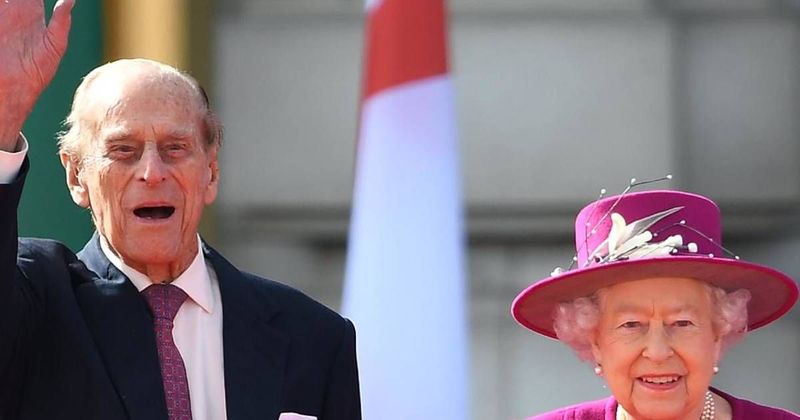 Queen Elizabeth II May Not Visit Husband Prince Philip In The Hospital Because Of 'COVID & Being 94,' Royal Expert Predicts