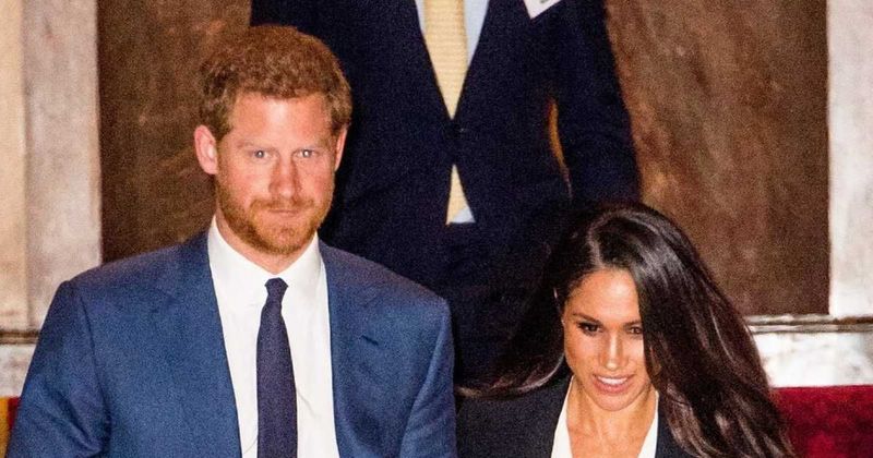 Exclusive: 'Palace Considering Stripping Meghan Markle & Prince Harry Of All Royal Titles' As The Drama Continues, Royal Source Reveals