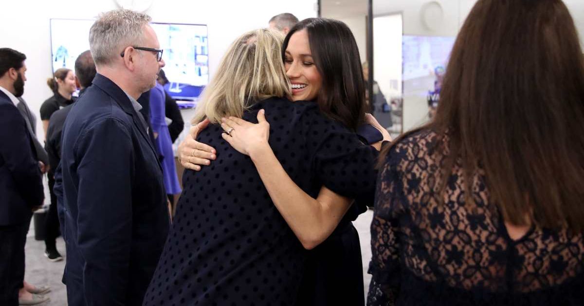 Meghan Markle hugs journalist Bryony Gordon as she meets panelists and beneficiaries during the first annual Royal Foundation Forum held at Aviva on February 28, 2018, in London, England. (Cover Image Source: Getty Images | Chris Jackson)