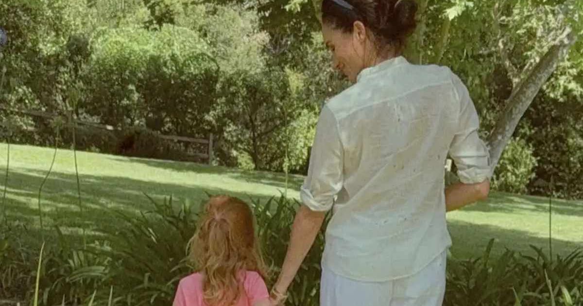 Meghan Markle and Princess Lilibet look on as they stand in a garden. (Cover Image Source: Instagram | @meghan)