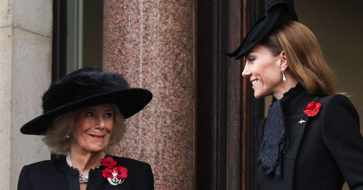 Britain's Catherine, Princess of Wales, and Britain's Queen Camilla react at a balcony during the annual 2025 National Service of Remembrance at The Cenotaph. (Cover Image Source: Getty Images | Toby Melville)