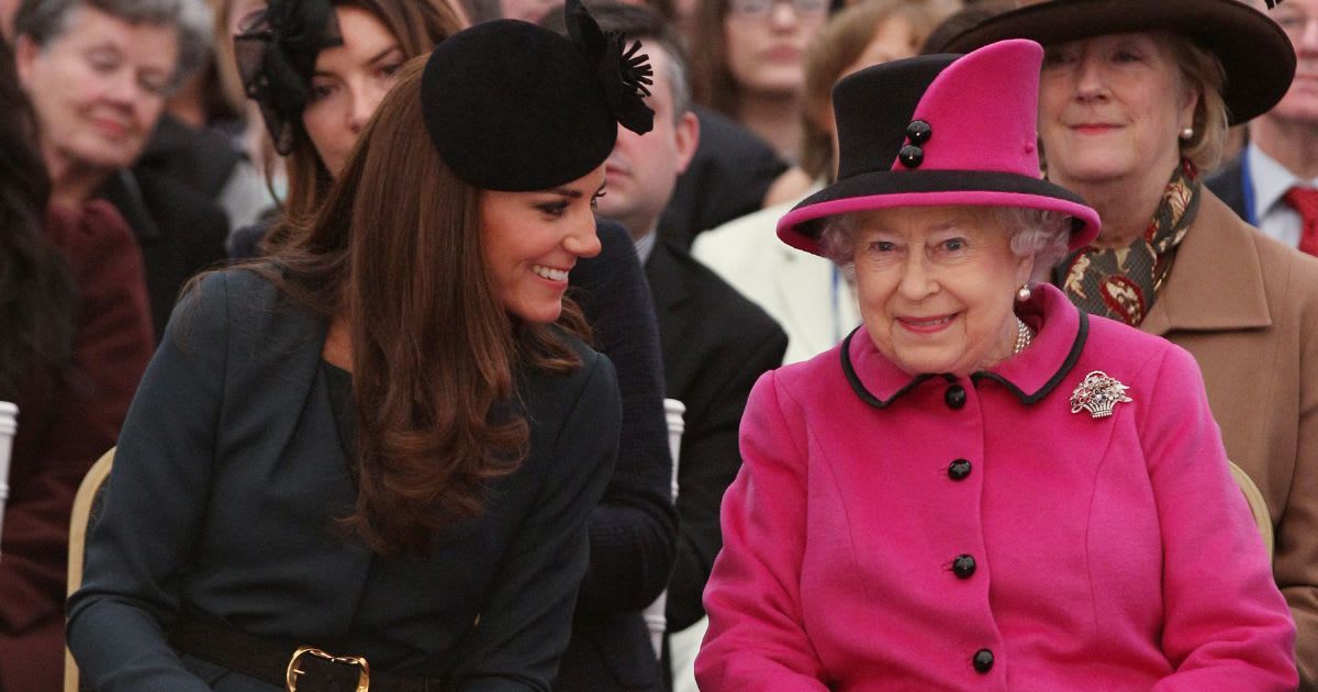 Catherine, Duchess of Cambridge and Queen Elizabeth II  watch a fashion show at De Montfort University in Leicester, England. (Cover Image Source: Getty Images | Oli Scarff - WPA Pool)