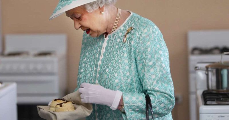 Resurfaced Photo Shows Queen Elizabeth Breaking Protocol and Eating With Her Hands — and We Love It