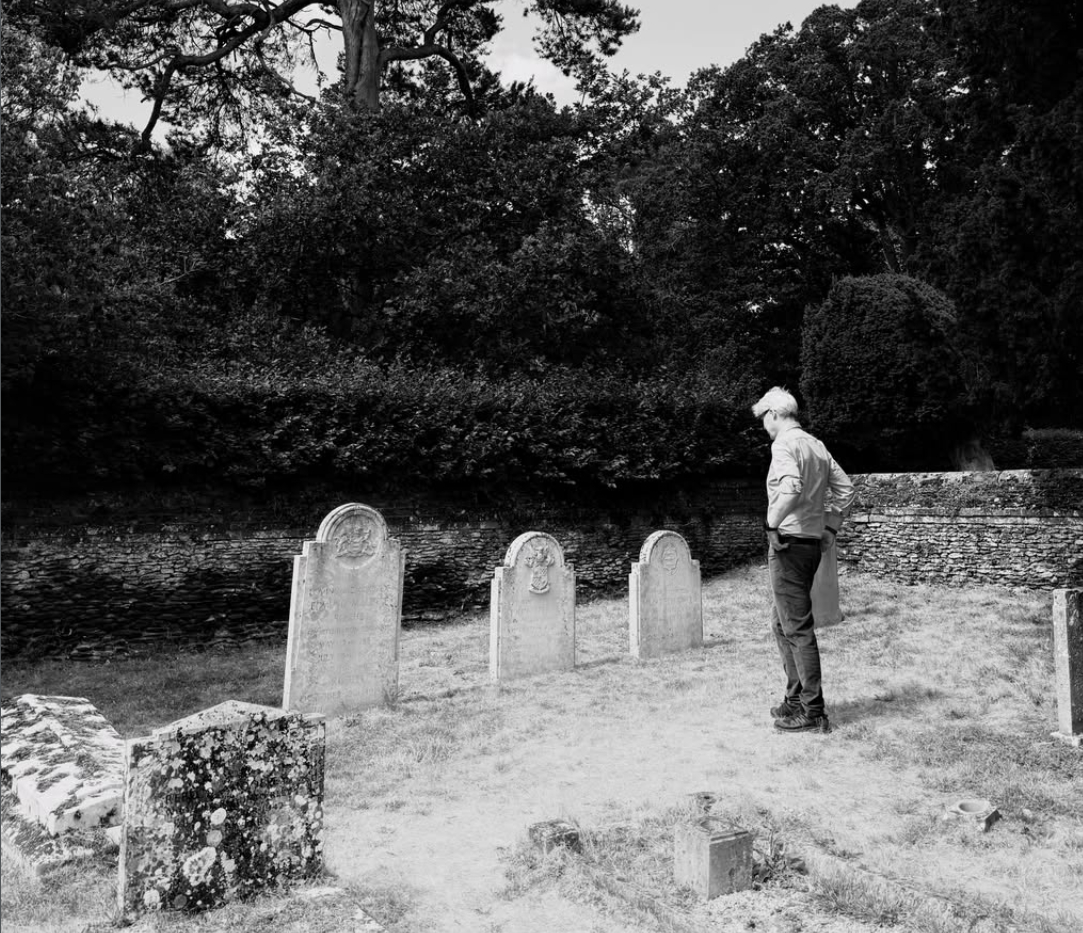 Charles Spencer at his brother, John Spencer's grave who died just after birth on January 12th 1960.  (Image Source: Instagram | @profcatspencer)