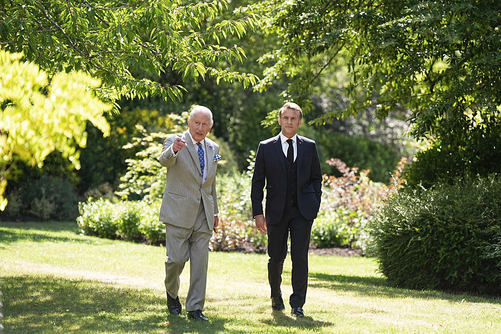 WINDSOR, ENGLAND - JULY 9: King Charles III and the President of France Emmanuel Macron visit the Windsor Castle Gardens on July 9, 2025 in Windsor, England. President Emmanuel Macron and Mrs Brigitte Macron visit the UK in the first visit State Visit made by France in 17 years. They are staying at Windsor Castle, hosted by King Charles III and Queen Camilla. Today, the Macrons will have lunch with the UK Prime Minister at Downing Street, and a banquet will be held in their honour at The Guildhall. (Photo by Aaron Chown - Pool/Getty Images)
