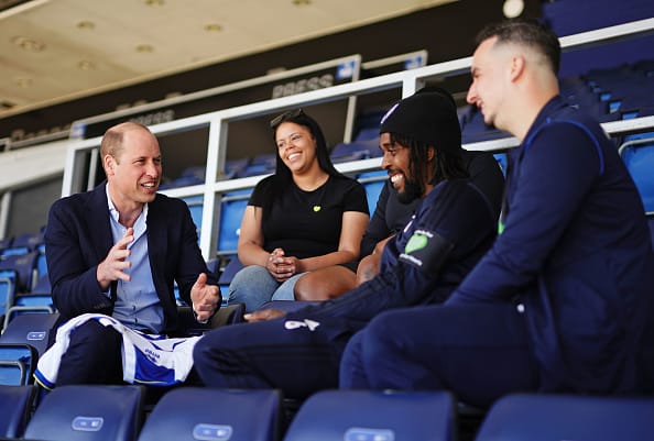 Prince William, Prince of Wales (L) meets with Grenfell survivors and bereaved during a visit to Queen's Park Rangers football club at Loftus Road on May 26, 2023 in London, England. The Prince of Wales is visiting the football club to learn of the support they have provided the community following the Grenfell Fire tragedy six years ago. (Photo by Aaron Chown - WPA Pool/Getty Images)