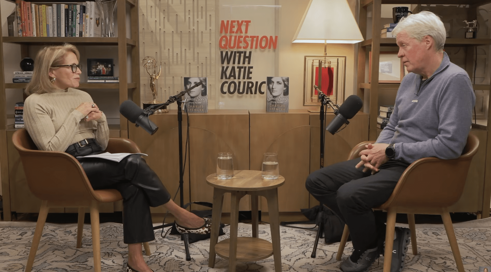 Katie Couric and Charles Spencer during the podcast. (Cover Image Source: YouTube | Katie Couric)